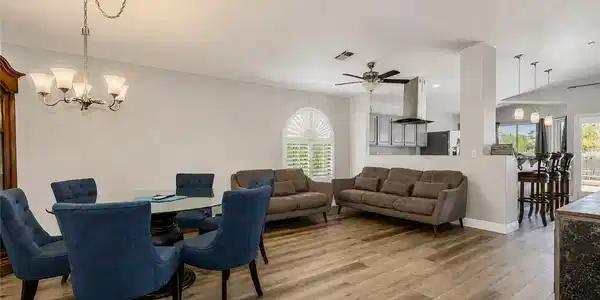 Image 4: An inviting open-concept living space features war
