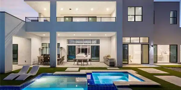 Image 3: Rear view of house featuring a patio, a pool with