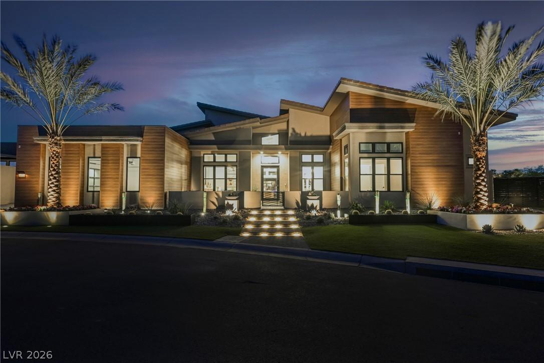 Image 3: Contemporary architecture glows under evening ligh