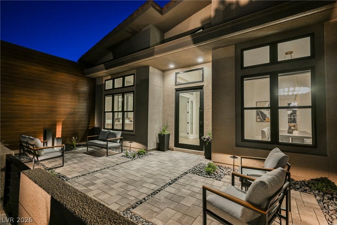 Image 4: A private, paver stone patio offers an ideal setti