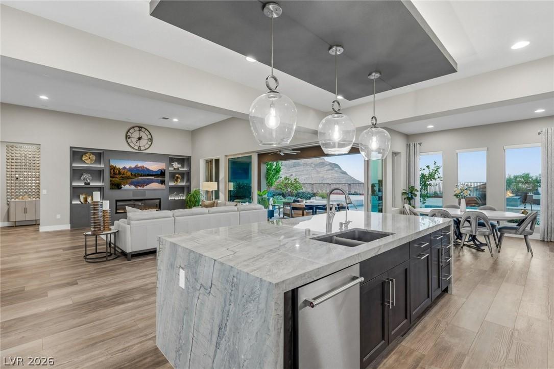 Image 4: An open-concept living space features a gourmet ki