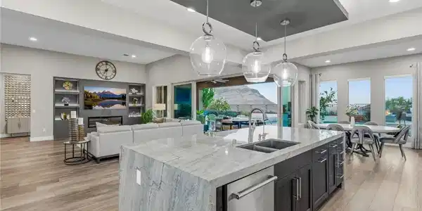 Image 4: An open-concept living space features a gourmet ki