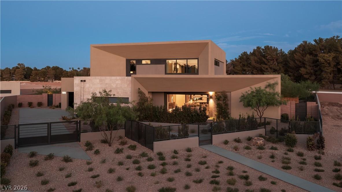 Image 1: A striking modern desert dwelling with illuminated