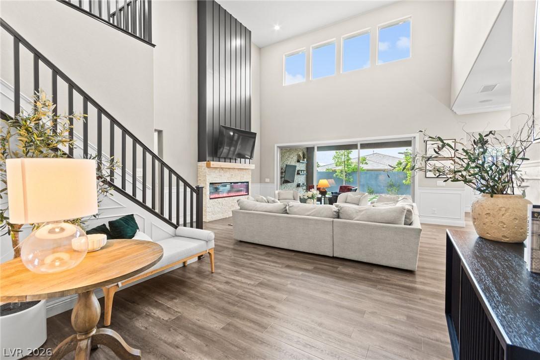Image 3: Grand living room with soaring ceilings and a cont
