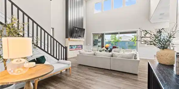 Image 3: Grand living room with soaring ceilings and a cont