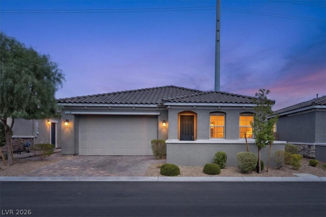 Image 1: An inviting front entry welcomes you to this resid