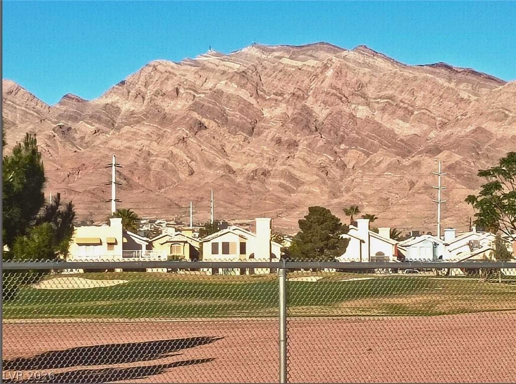 Image 1: This scenic landscape captures residential homes n