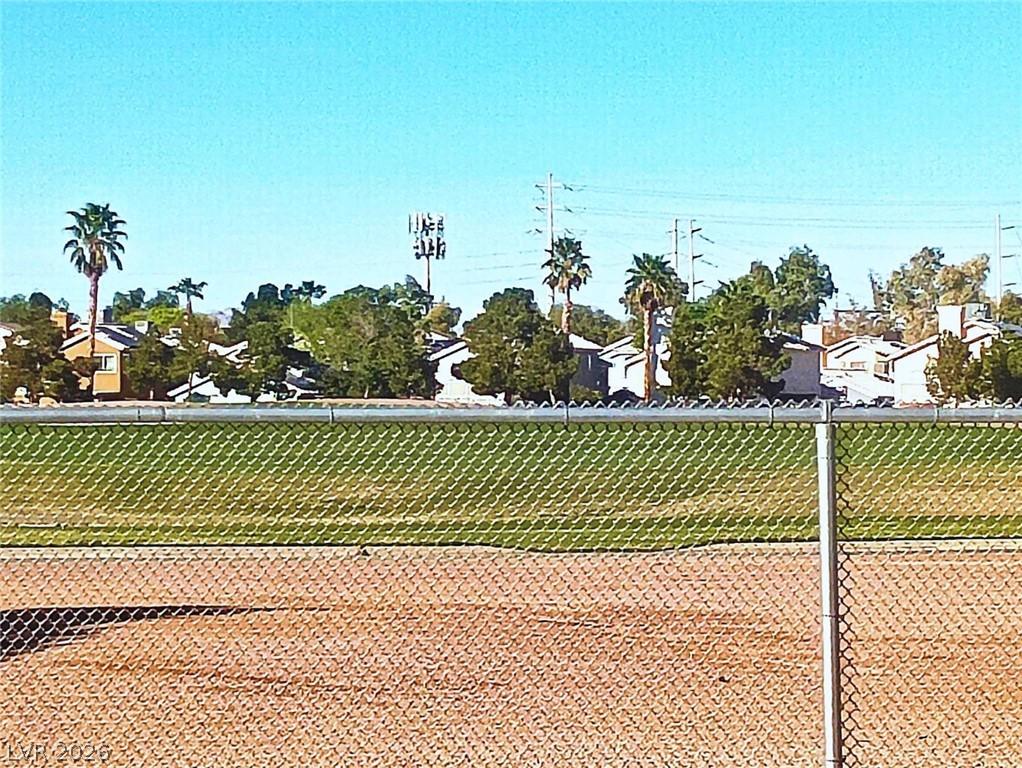 Image 2: This scenic landscape features residential propert