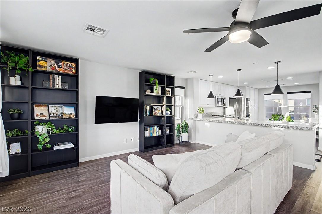 Image 4: This bright living space seamlessly transitions in