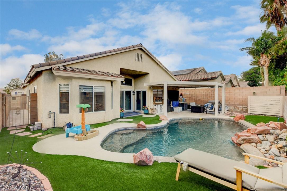 Image 2: An inviting backyard oasis awaits with a sparkling