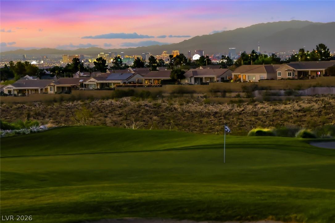 Image 2: A golf course green offers panoramic evening views