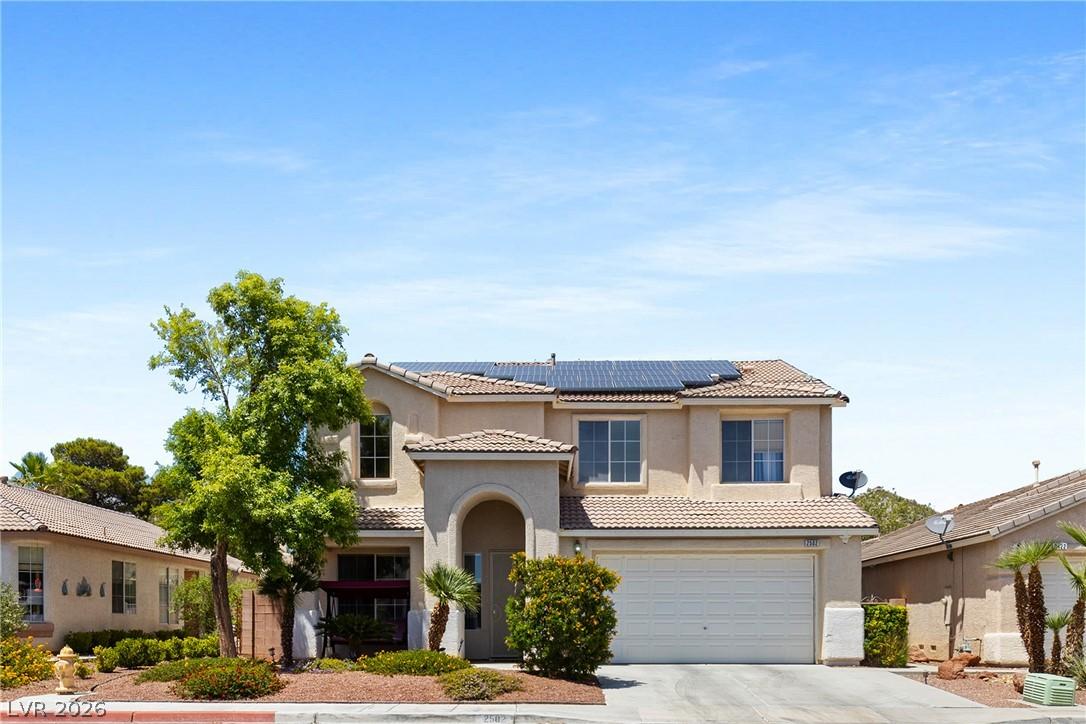 Image 2: A welcoming front exterior with mature landscaping