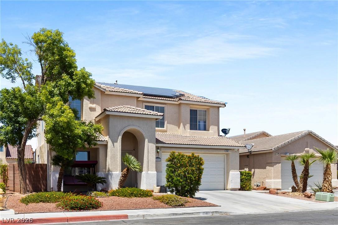 Image 3: A charming two-story residence with solar panels a