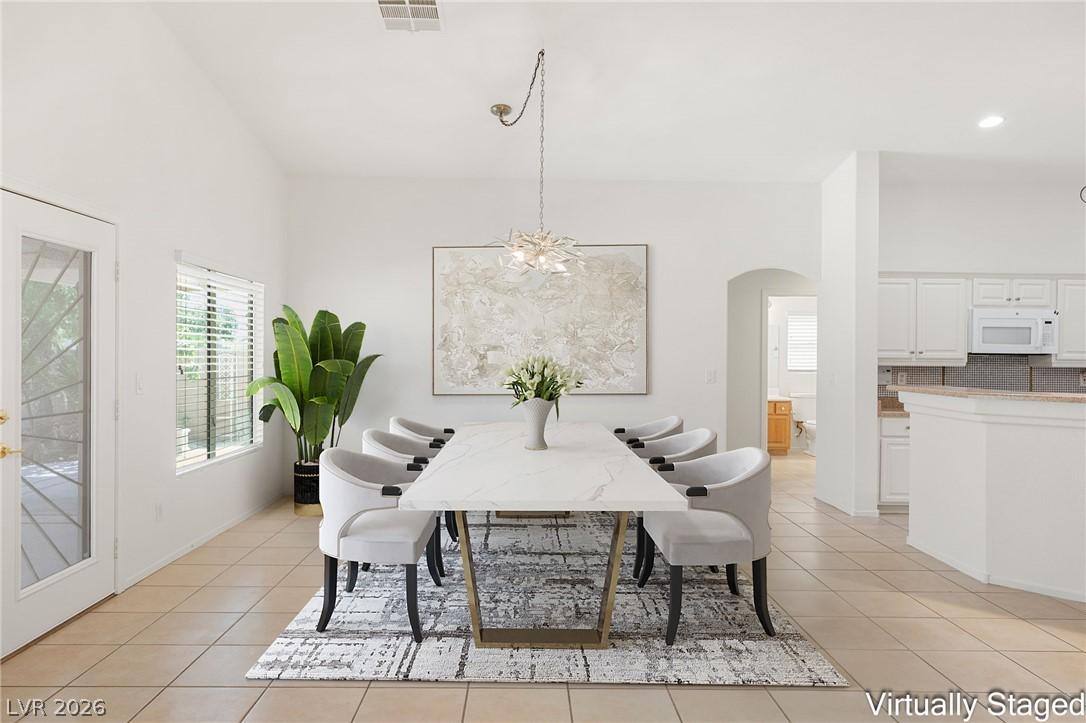 Image 3: An open floorplan dining space seamlessly connects