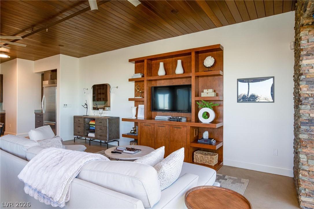 Image 3: An inviting open-concept living area features a cu