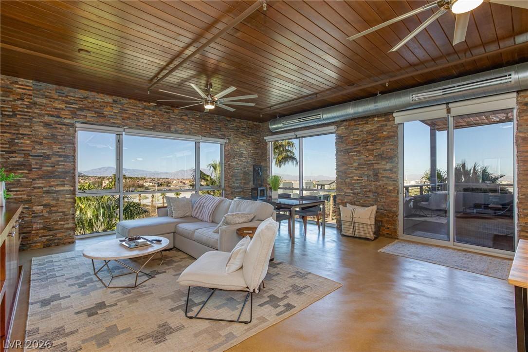 Image 4: A spacious living area features panoramic views th