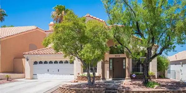 Image 4: An inviting front facade features a two-car garage