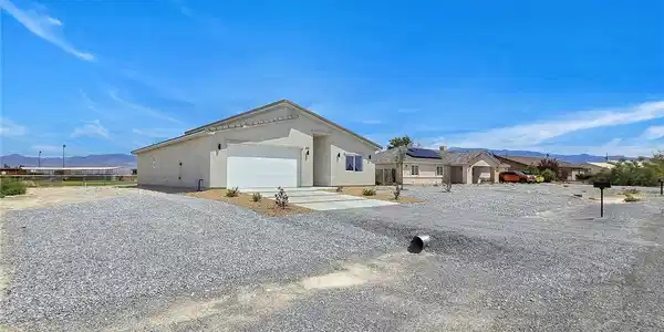Image 4: Clean lines and low-maintenance desert landscaping