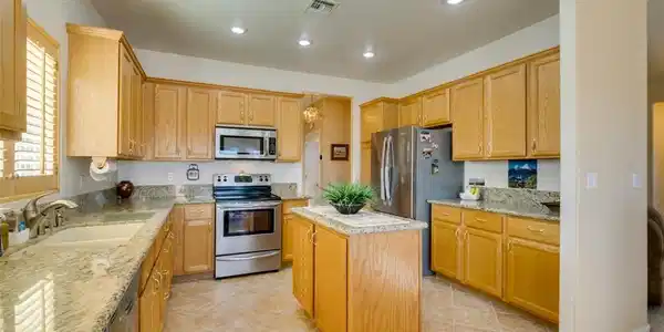 Image 3: Gleaming granite countertops pair beautifully with
