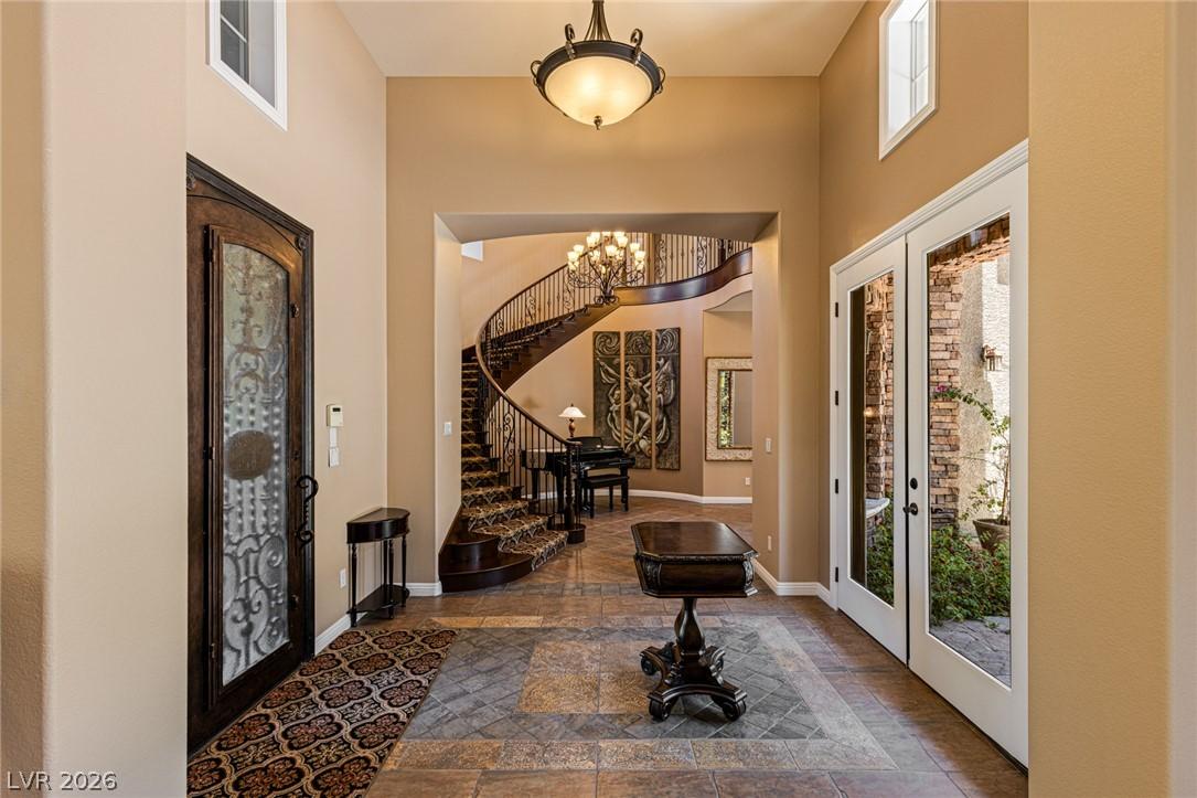Image 2: Welcome home to a grand entry and elegant foyer, w