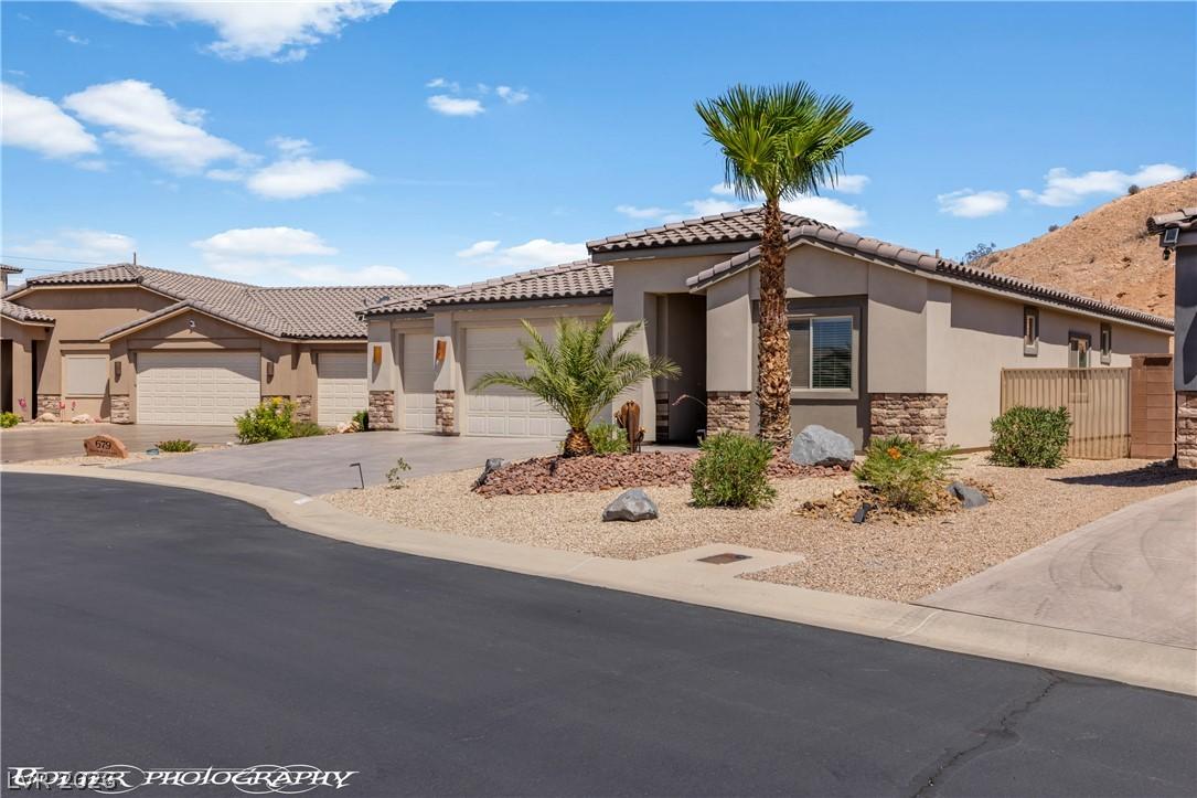 Image 4: A desert oasis with stucco and stone construction,