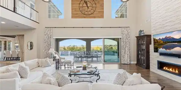 Image 4: The soaring ceilings and expansive glass doors cre