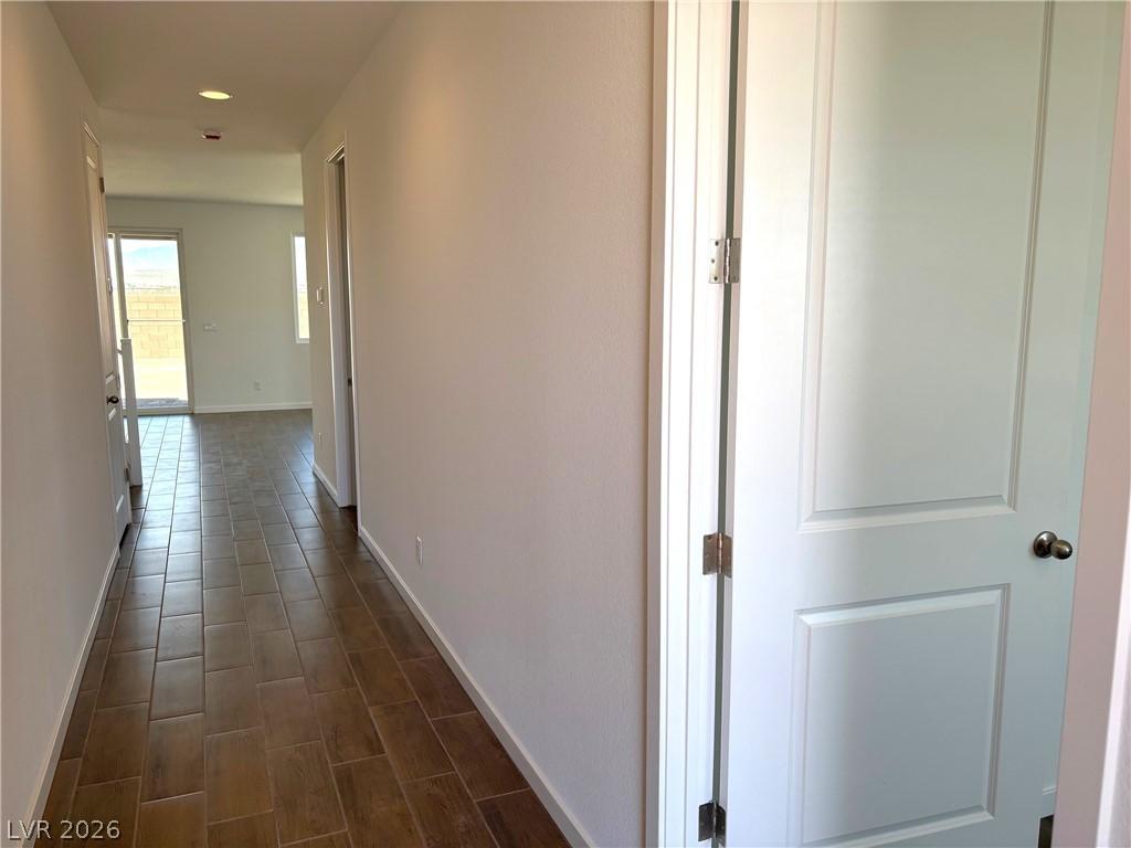 Image 3: Hall featuring wood finish floors and recessed lig