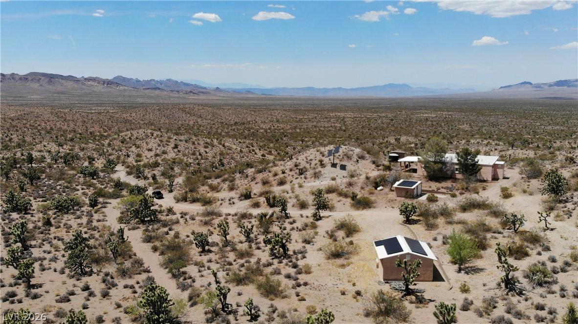 Image 1: A tranquil desert landscape unfolds with distant m