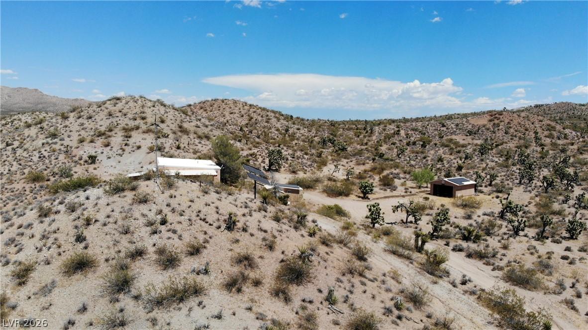 Image 3: Perched on a sun-drenched desert hillside, this re