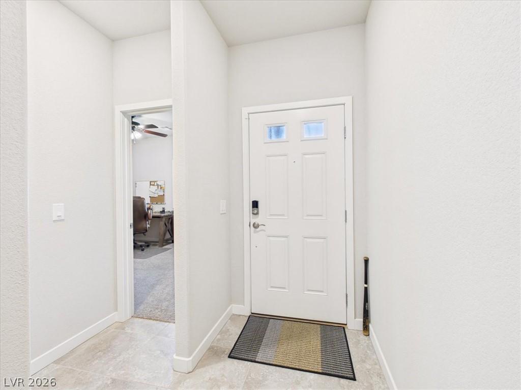 Image 2: A welcoming entryway with durable tile flooring an