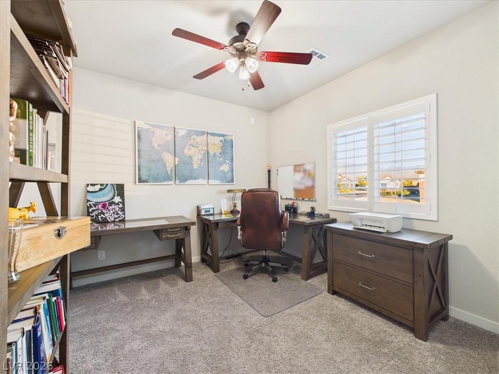 Image 3: A well-lit study with ample workspace for producti