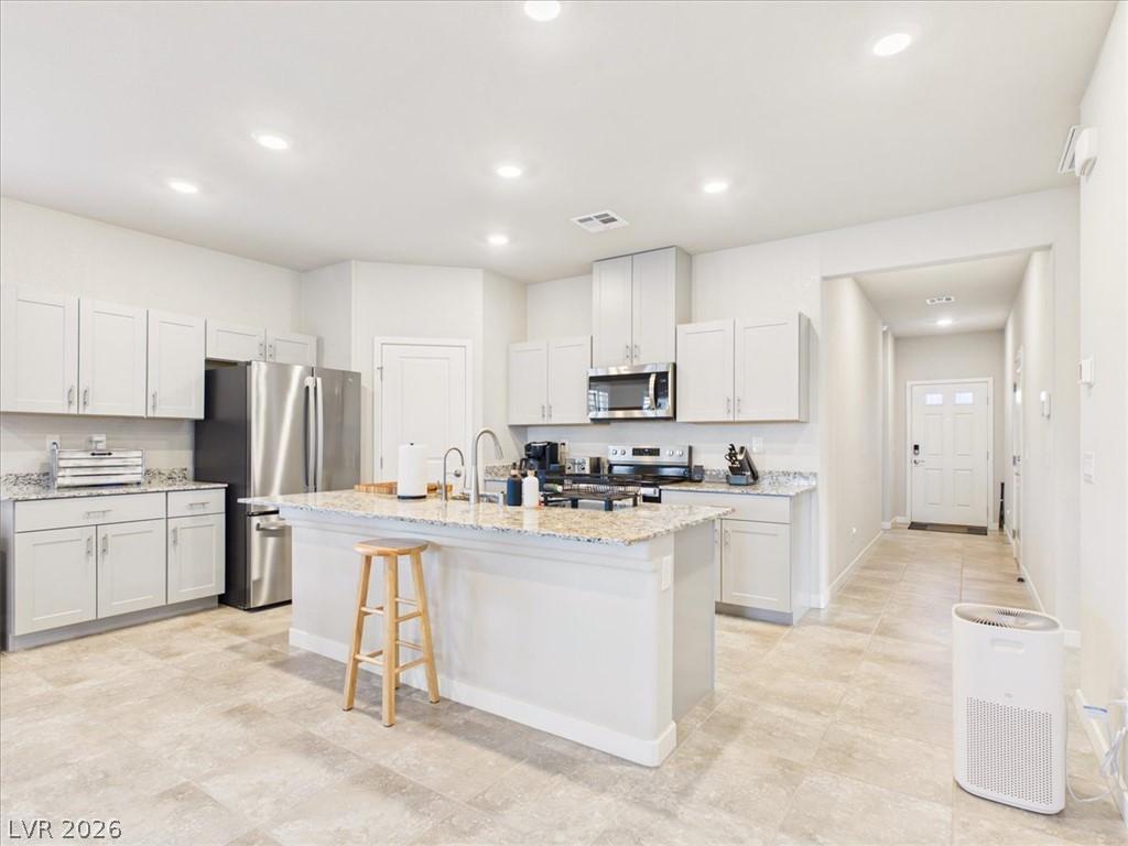 Image 4: Culinary delights await in this bright kitchen wit