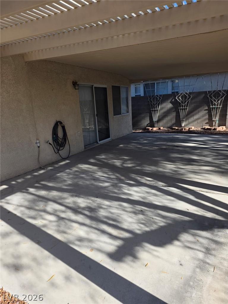 Image 4: An inviting covered patio offers ample space for o