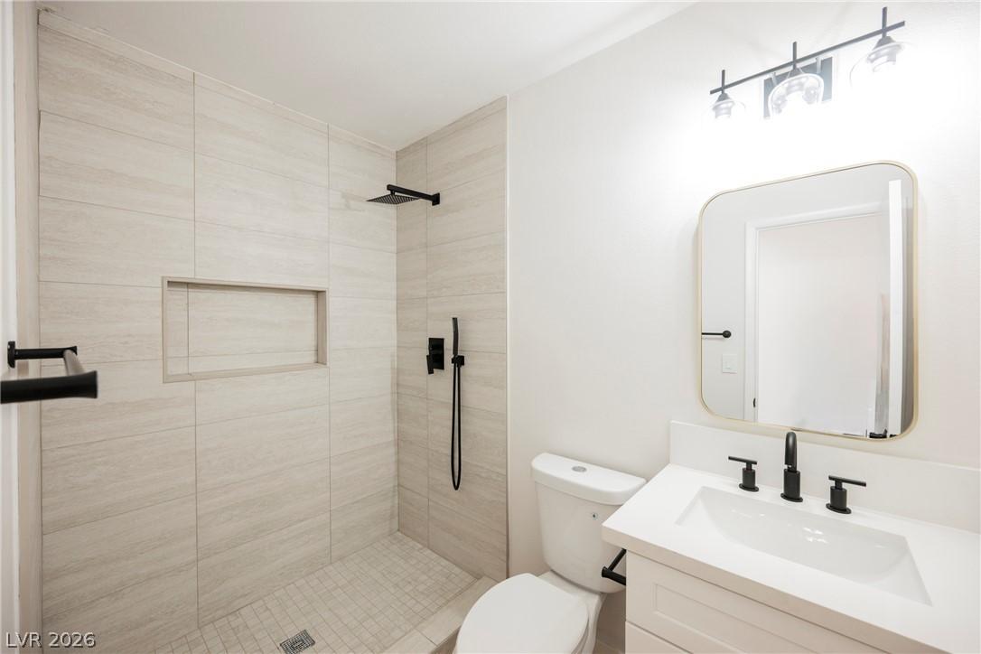 Image 2: A well-appointed bathroom features a spacious show