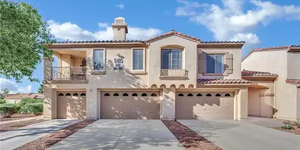 Image 2: Spanish tile accents and integrated garages define