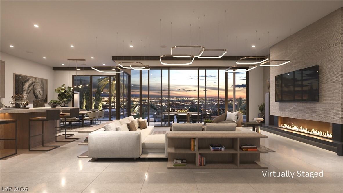 Image 2: Floor-to-ceiling windows frame a mesmerizing city
