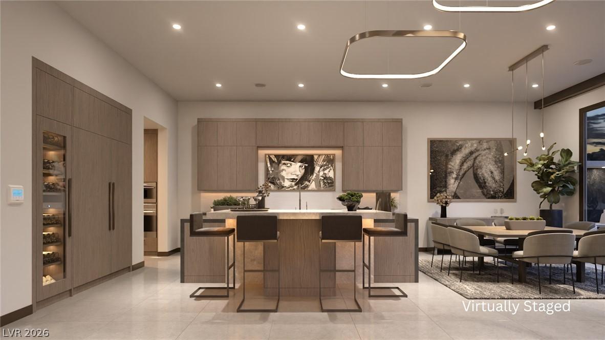 Image 3: A well-lit, contemporary kitchen and dining space