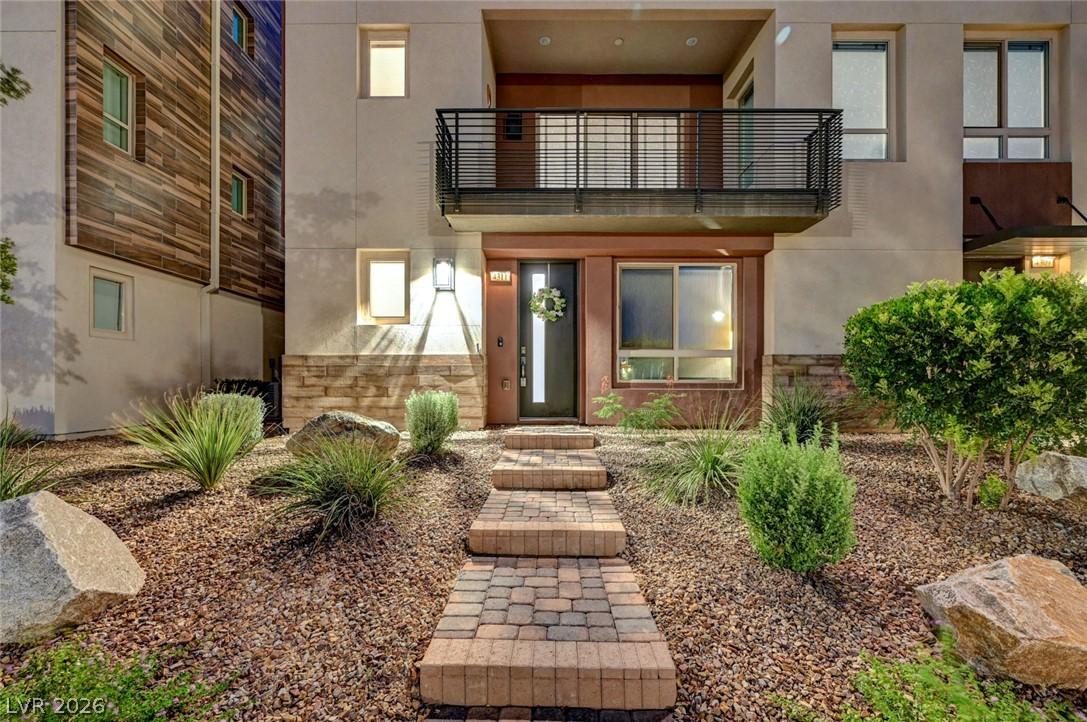Image 4: A contemporary exterior facade features a sleek ba