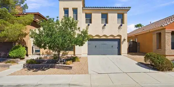 Image 2: An attached two-car garage features durable concre