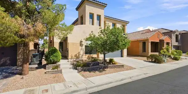 Image 3: An attached multi-car garage provides extensive ut