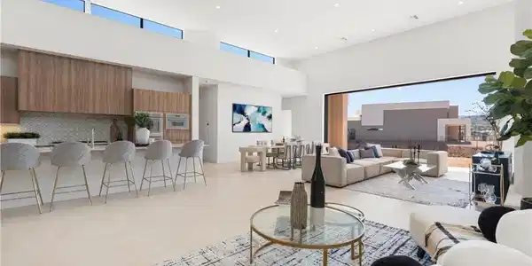 Image 4: An open floorplan seamlessly connects the kitchen,