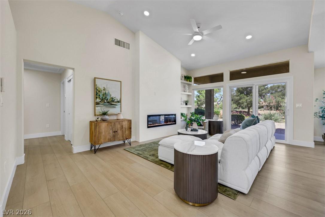 Image 3: A luminous living area showcases a sleek, linear f