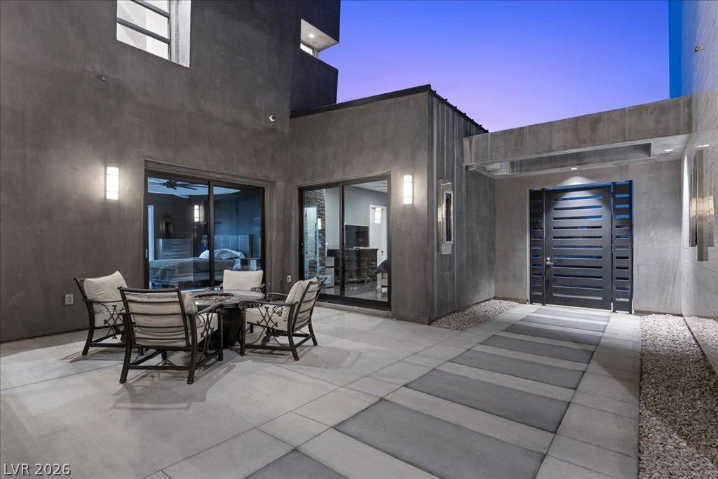 Image 3: An inviting private courtyard features sleek concr