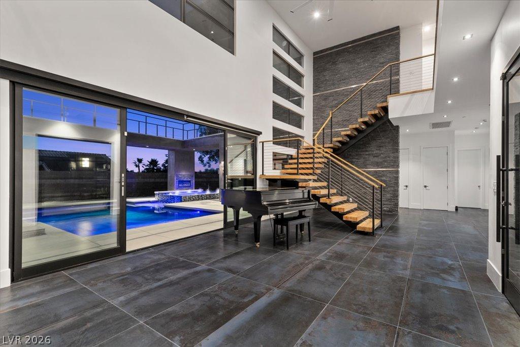 Image 4: A grand entrance with an open floor plan, featurin