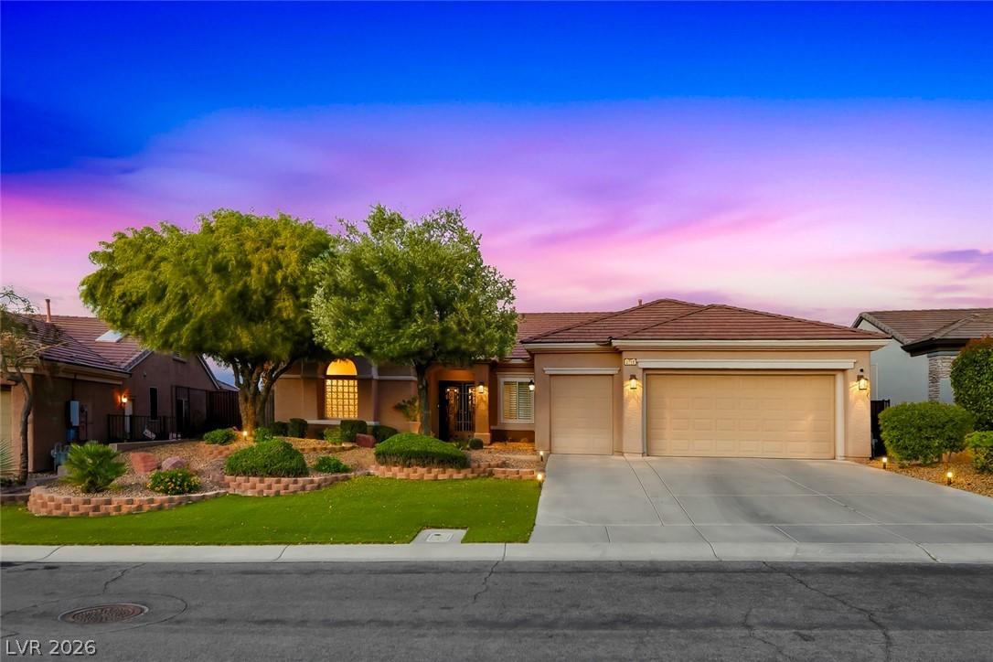 Image 4: An inviting exterior with mature landscaping and a