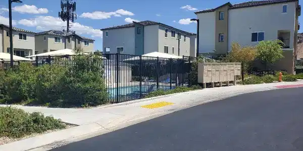 Image 2: Community pool area and residential structures awa
