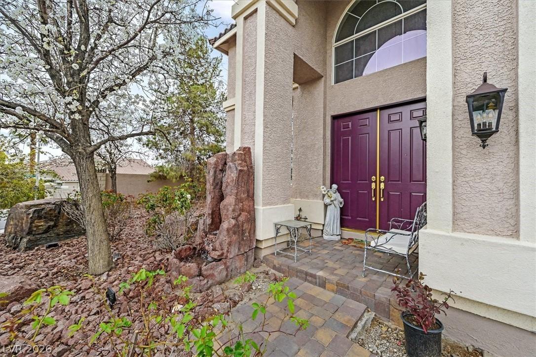 Image 3: A welcoming entry features plum-colored double doo