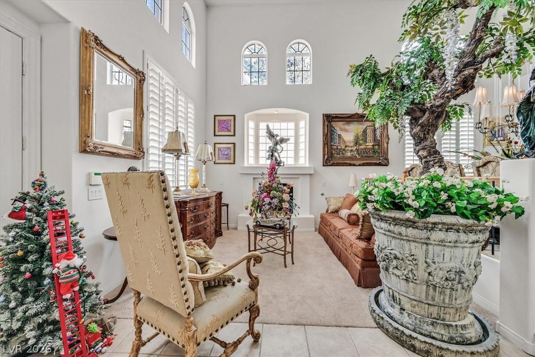 Image 4: A grand living space welcomes with a soaring ceili