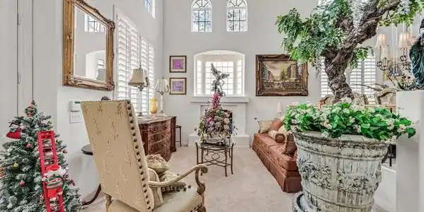 Image 4: A grand living space welcomes with a soaring ceili