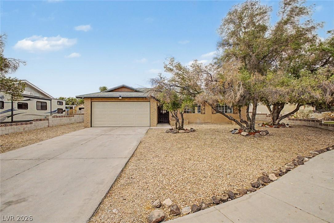 Image 2: A well-maintained single-story home with an attach